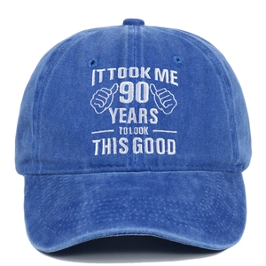 Detail of 90th birthday embroidery on blue washed cotton vintage baseball cap