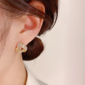 Exquisite gold knotted stud earrings with shimmering rhinestones for women
