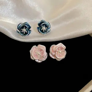Exquisite pink and blue floral pearl stud earrings with sparkling zirconia petal edges