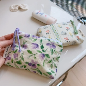 Floral cotton mini pouches with zipper closure and woven ropes in purple and green