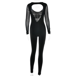 Close-up of black long sleeve athletic jumpsuit featuring a chic cutout back design