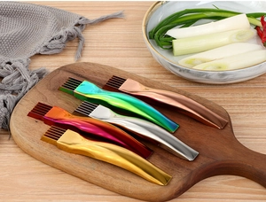 Kitchen scallion shredders in various colors displayed on a wooden cutting board