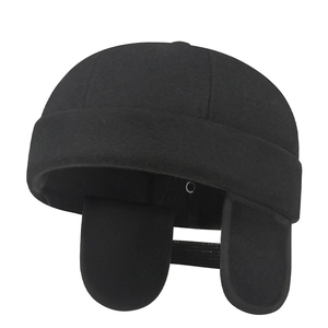 Winter wool docker hat with ear flaps in black for cold weather outdoor protection
