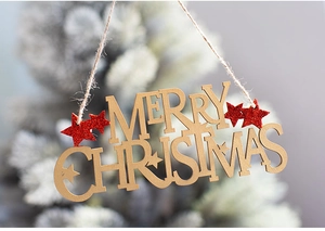 Detail of wooden Merry Christmas hanging sign with red glitter star and jute twine cord