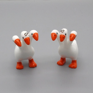 Creative three-headed goose pendant in white and orange with metal hanging loop
