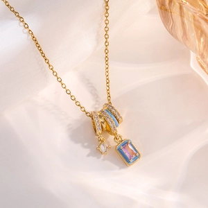 Chic gold necklace with blue enamel bear camera pendants and pink zircon charms