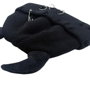 Black knit devil horn beanie with punk silver pins and distressed ripped details