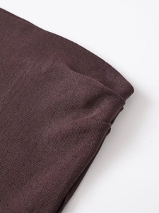 Macro shot of dark burgundy ribbed knit fabric showing fine texture and high elasticity