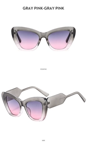 Detail view of cat-eye sunglasses with gray transparent frame and purple gradient lenses