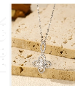 Macro shot of S925 sterling silver four-petal flower pendant with sparkling pavé zircons