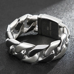 Detail showing 316L stainless steel engraving on silver cuban chain link bracelet