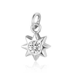 Macro shot of silver star pendant with round cubic zirconia center and polished ring