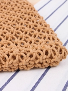 Handwoven shoulder bag in warm camel brown with geometric mesh pattern for casual outings