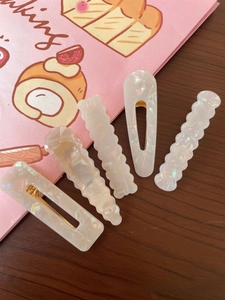 Detailed set of 5 iridescent white geometric hair clips with gold metal back clips