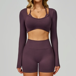 Close-up of deep purple seamless knit athletic set including long sleeve top and shorts