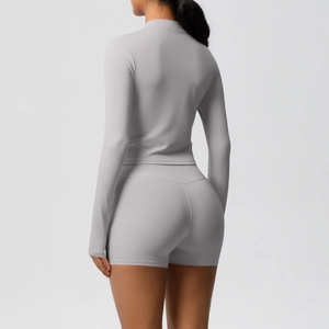 Rear view of tight gray yoga set with stand-up collar jacket and high waist gym shorts