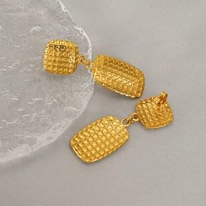Fashionable gold woven geometric rectangular earrings featuring textured metal squares