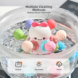 Baby Manhattan teething ball being sterilized in boiling water to show heat resistance