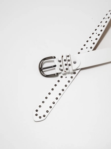 Close-up of white leather belt with gunmetal studs and buckle for y2k punk aesthetic