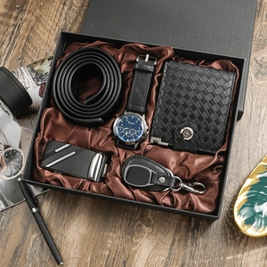 Business gift set for men featuring a black watch, wallet, belt, and key holder