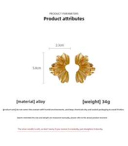 Detailed view of gold pleated petal earrings with size annotations and alloy texture