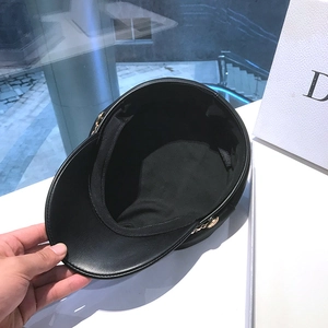 Chic black leather baker boy hat for women with gold chain trim and side buttons detail