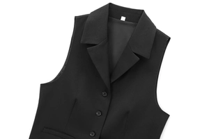 Flat lay close-up of a black sleeveless vest showing the lapel collar and button detail