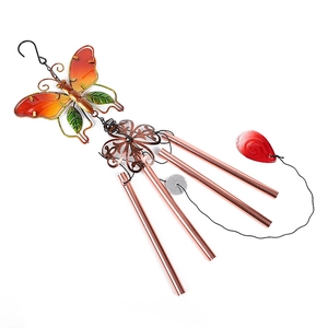 Detailed view of metal butterfly wind chime with orange glass and four bronze tubes