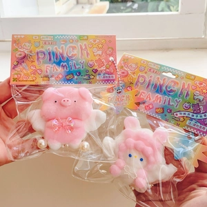 Soft angel-themed squishy stress relief toys in colorful rainbow retail packaging