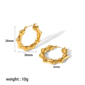Detail showing 38mm diameter and 6mm thickness of gold-plated bamboo hoop earrings