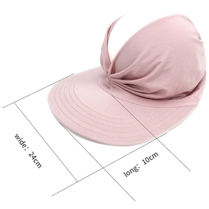 Pink sun visor with twist detail and 24cm wide brim dimensions for UV protection