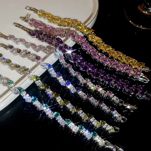 Detailed view of colorful pear-cut cubic zirconia tennis bracelets in various shades