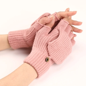 Detailed pink knitted fingerless gloves with a buttoned flap and striped texture