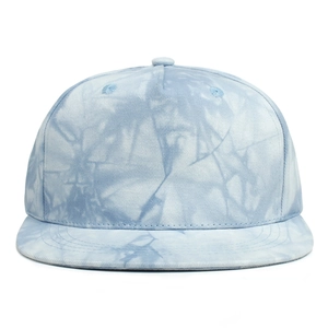 Detail of light blue and white tie-dye pattern on kids hip hop flat brim baseball cap