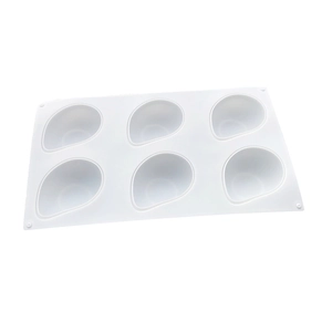 Detail of 6-cavity white silicone mold with teardrop shapes for DIY baking and mousse cakes
