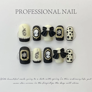 Vintage style black and white press-on nails with 3D bows, cameo relief and pearls