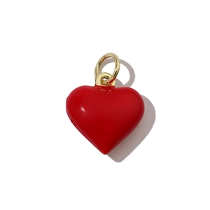 Detailed view of glossy red enamel heart charm with gold ring for DIY jewelry making