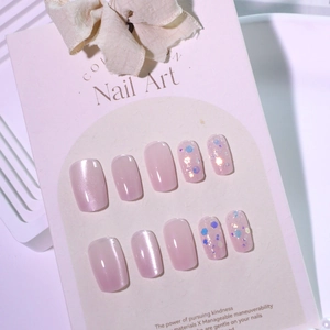 Glittery pink cat eye press-on nails with sequins and micro-pearls in a 10-piece set