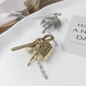 Elegant gold and silver hair hook clips with pearl chains for low ponytail styling