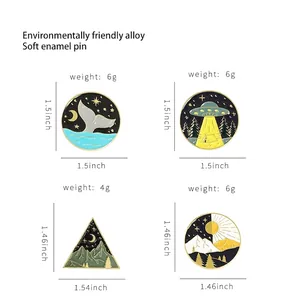 Enamel pins set with whale tail and geometric landscape patterns showing product dimensions
