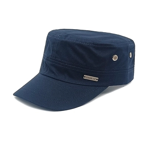 Detail view of the navy cotton cadet cap showing metal air eyelets and brand plate