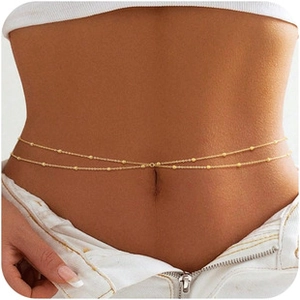 Detail of gold double-layered waist chain with small beads shown on a model waist