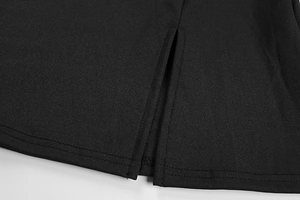 Close-up of black dress hem showing a slit detail and professional double-needle stitching