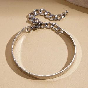 Detailed close-up of silver geometric bracelet with adjustable chain and lobster clasp
