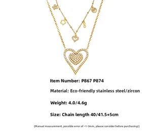 Detailed view of gold stainless steel layered heart necklace with zircon leaf pendants