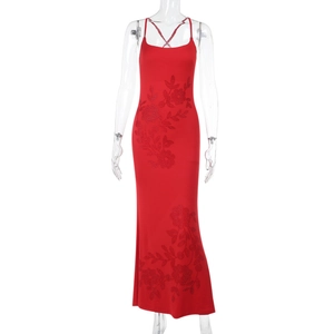 Detail of red slim fit maxi dress featuring intricate floral rhinestones and thin straps