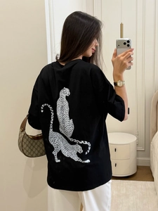 Women's casual oversized black cotton T-shirt featuring a white leopard back print