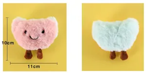 Detailed view of 10cm heart-shaped cat plush toy with catnip and bell features