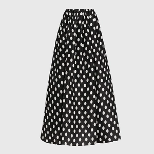 Detailed view of high-waist polka dot A-line maxi skirt with elegant pleated waistline