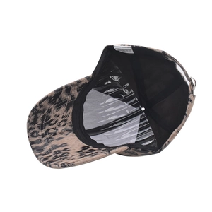 Detail of leopard print baseball cap interior featuring a white wash label and shape support